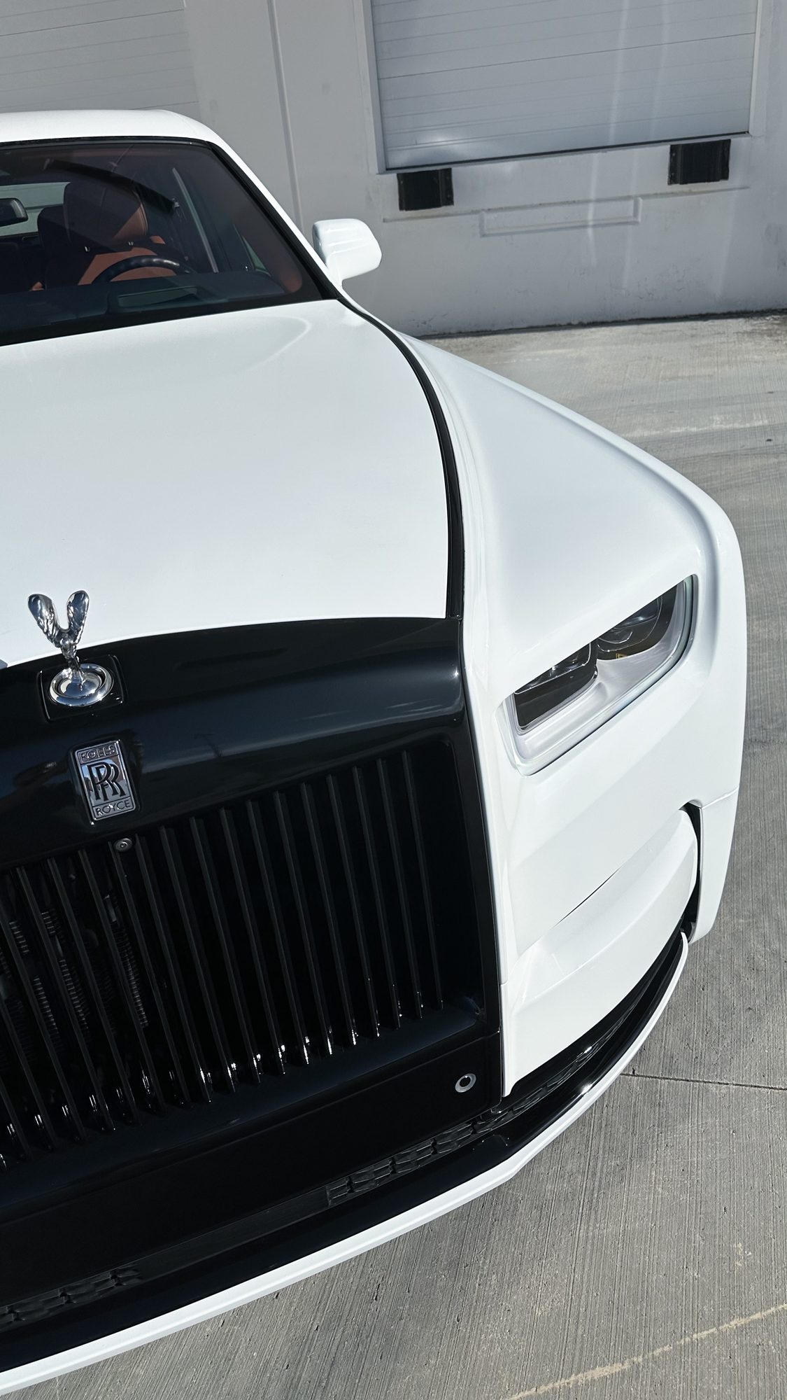White Rolls-Royce Phantom with its chrome trim blacked out by Restyle Miami