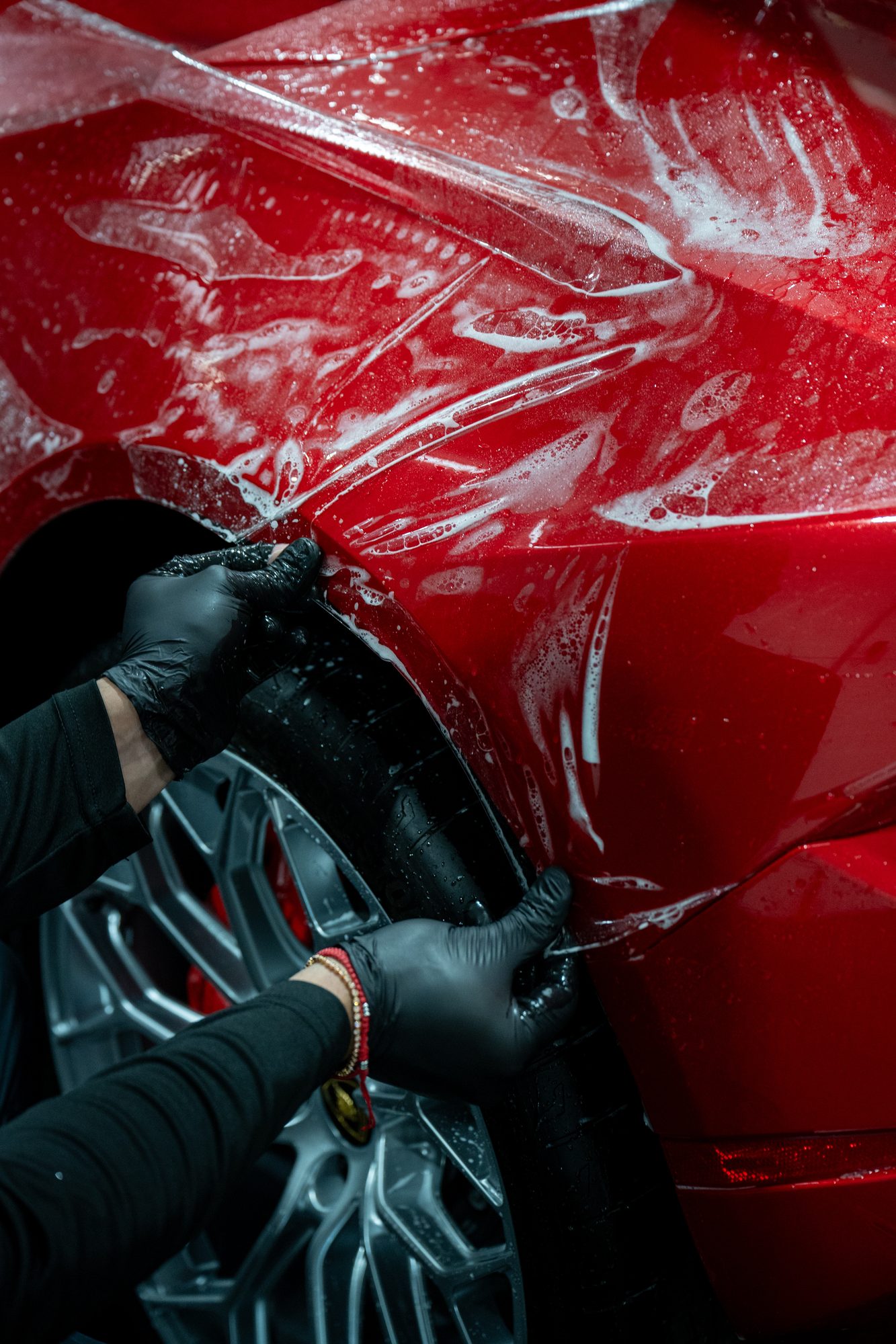 Red sports car protected with self-healing paint protection film by Restyle Miami