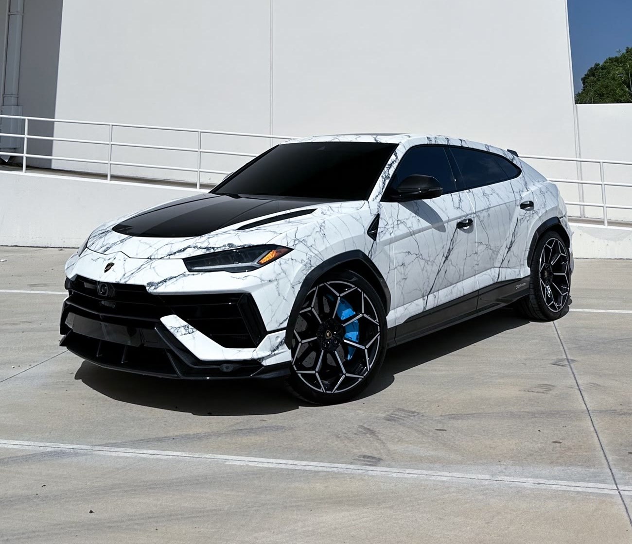 Lamborghini Urus finished in a marble-effect color-change wrap by Restyle Miami
